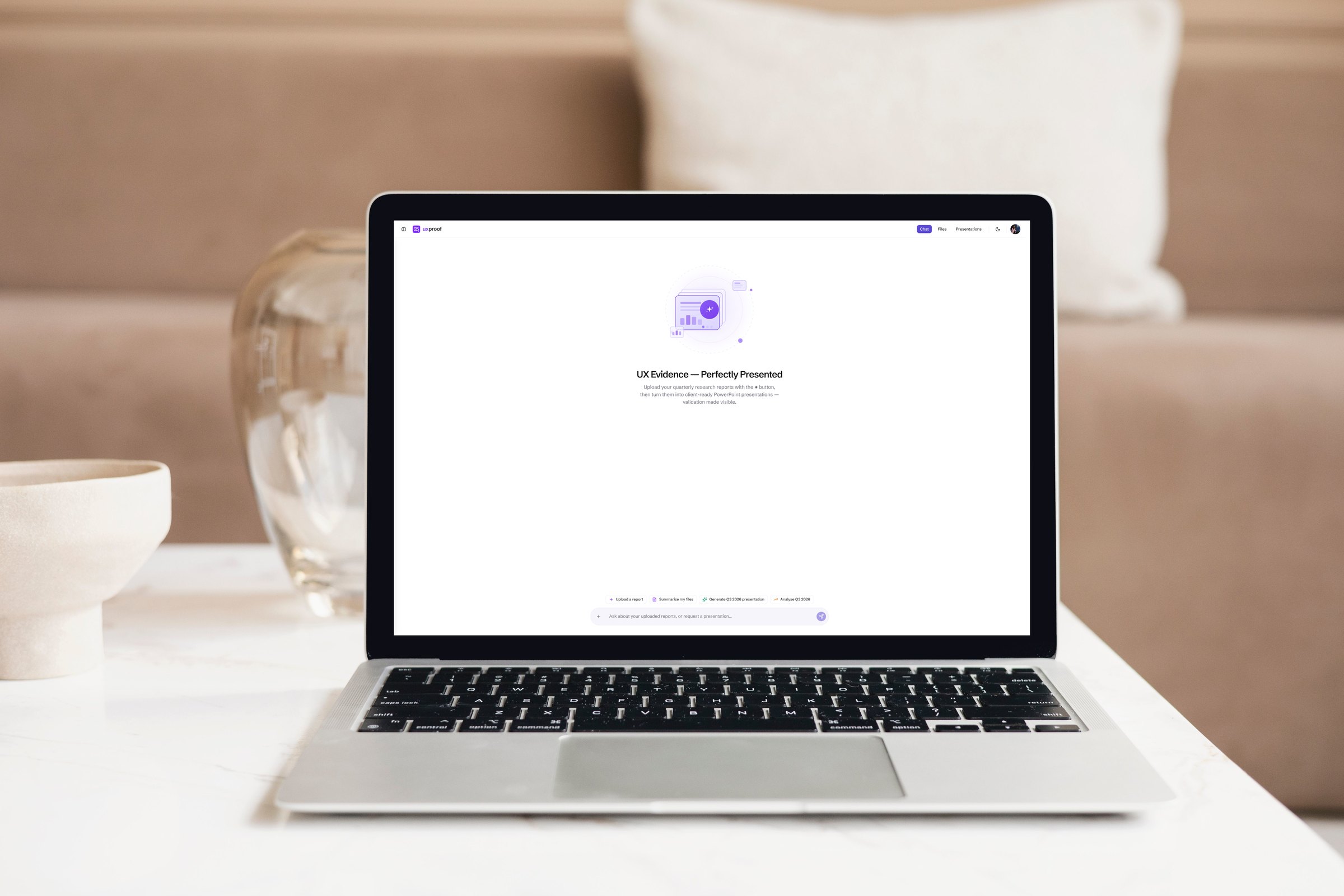 uxproof open on a laptop: the chat home with the welcome headline, a row of quick actions and the composer at the bottom
